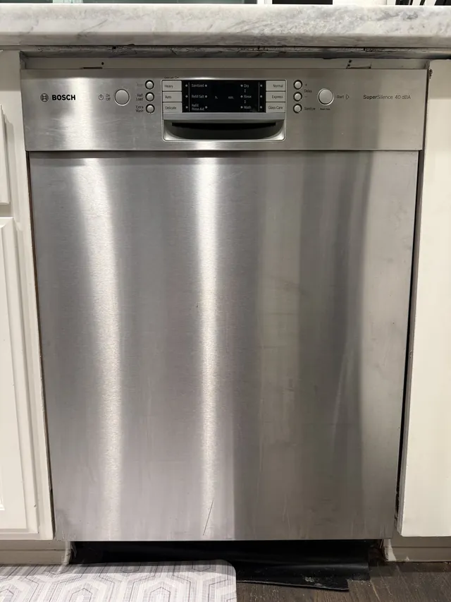 Bosch stainless dishwasher under a kitchen counter