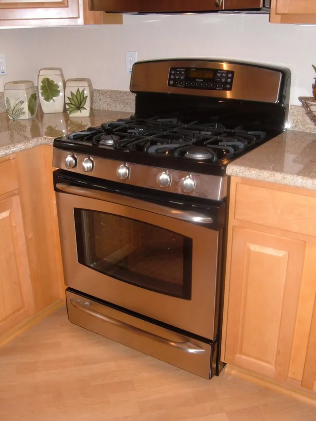 GE Profile stainless gas range in a kitchen