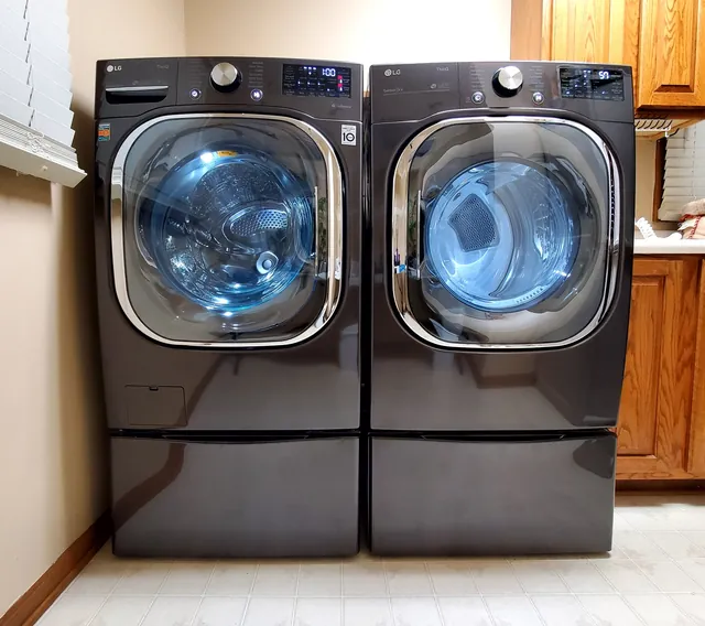 LG front-load washer and dryer pair in a home laundry room